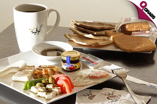 For QR25 Enjoy Your Choice of Beverages like Coffee & Smoothies with Some Delicious Food! (QR50 Value)